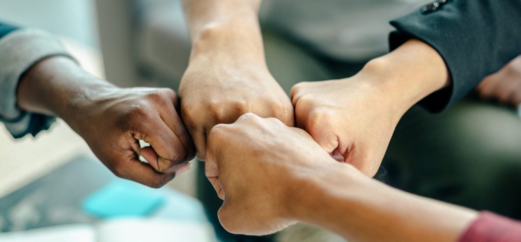 People fist bumping