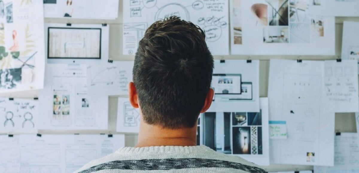 Man looking at wall