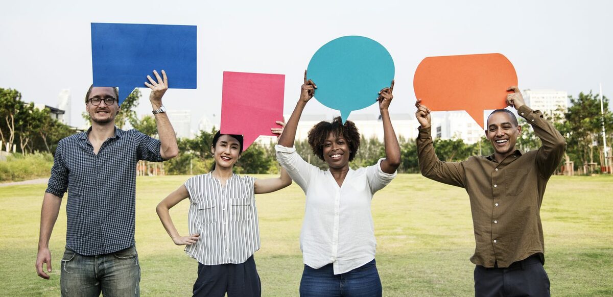 People holding speech bubbles