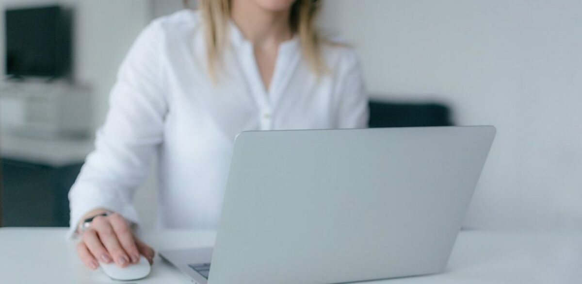 Woman in white typing