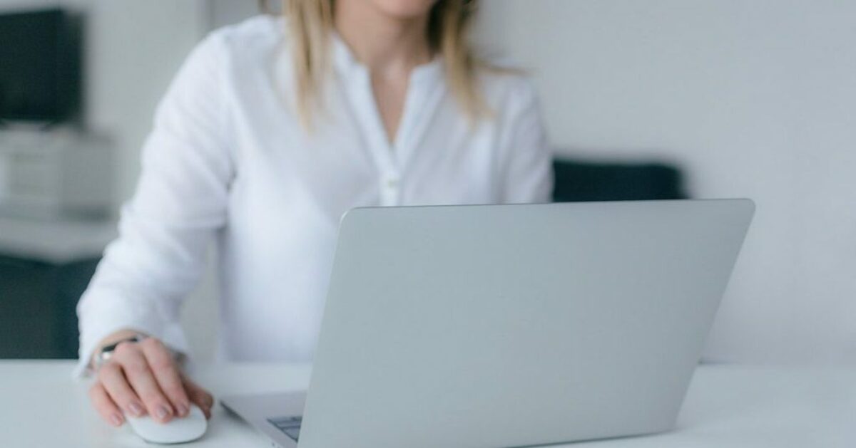 Woman in white typing