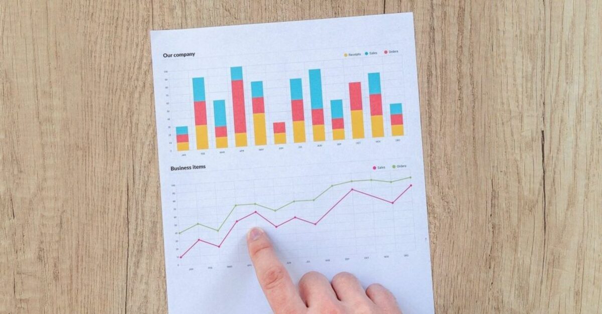 Person pointing at graph