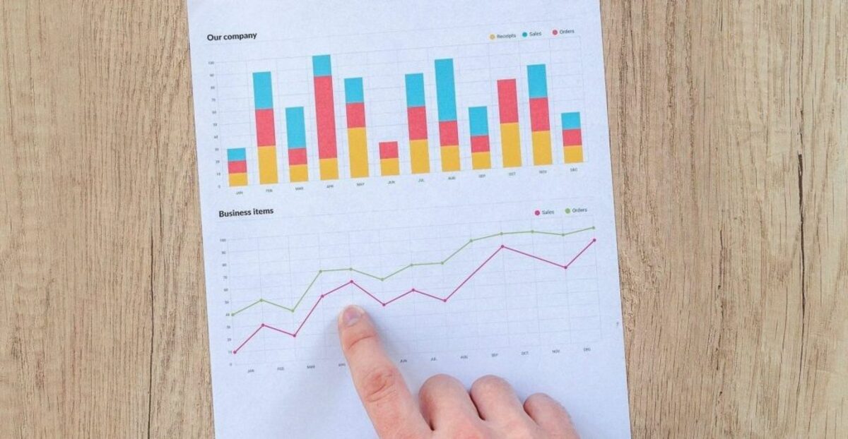 Person pointing at graph