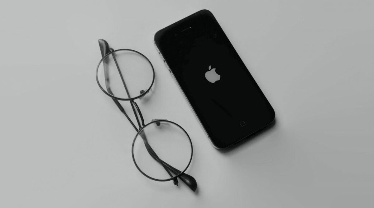 Image of Apple phone and glasses