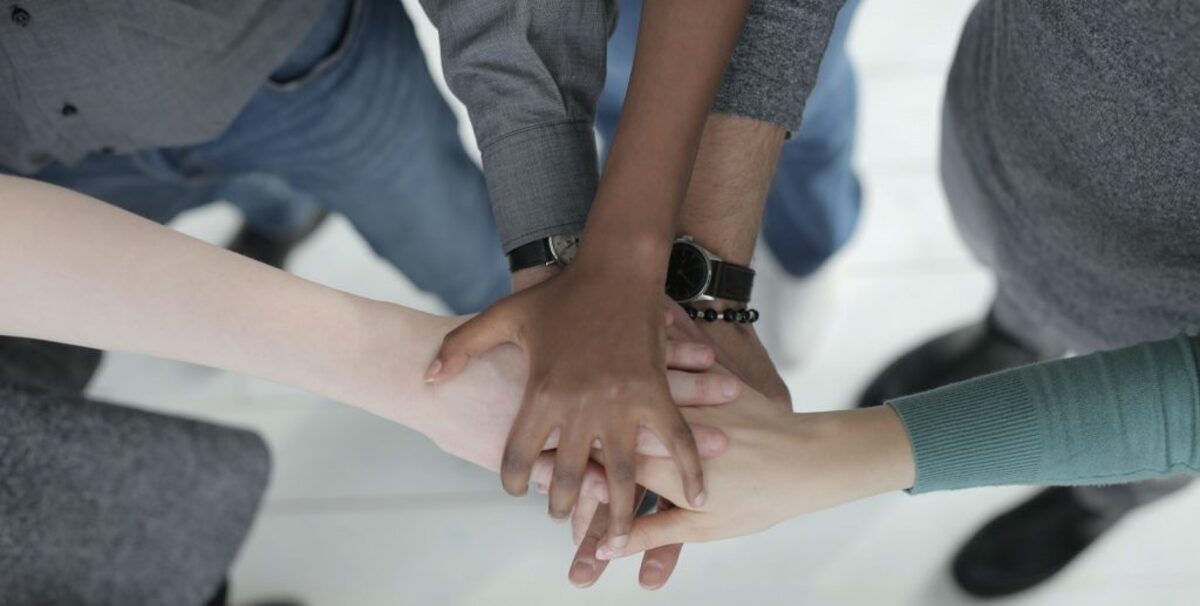 Image of group handshake