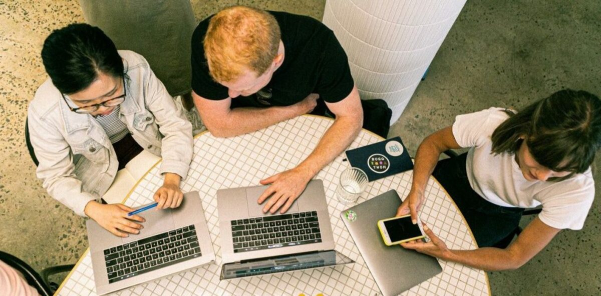 Image of people in office with laptop