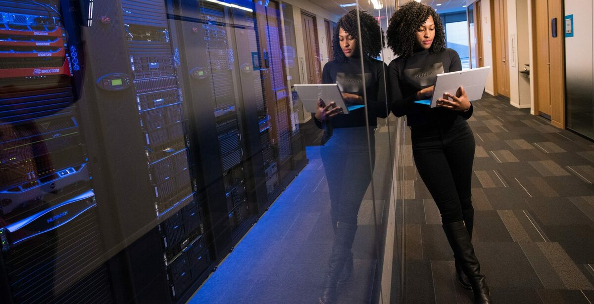 Woman standing next to a server