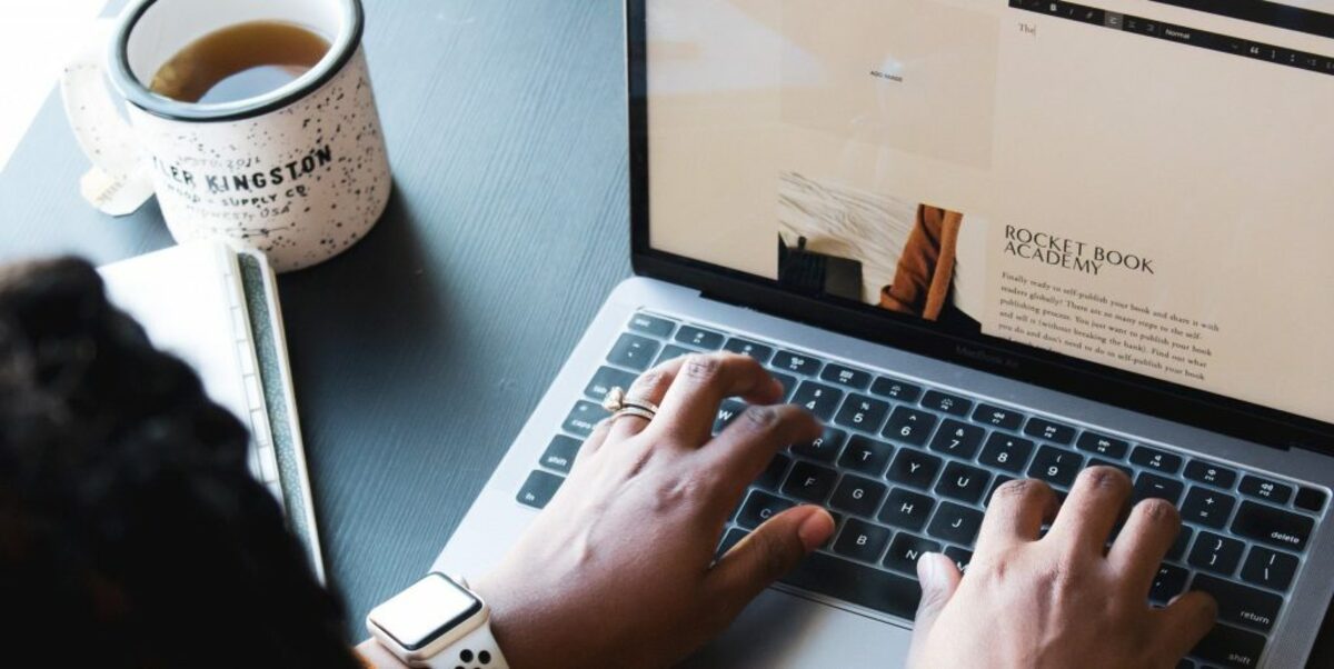 Woman typing on a keyboard