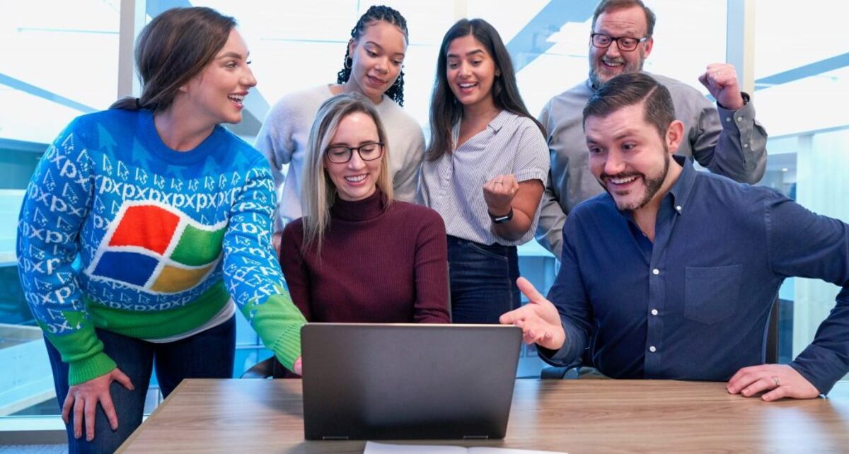 Festive holiday office party in #WindowsUglySweater Softwear by @Windows