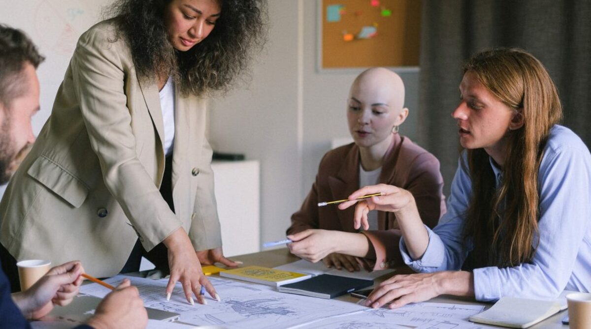 Focused colleagues brainstorming in boardroom