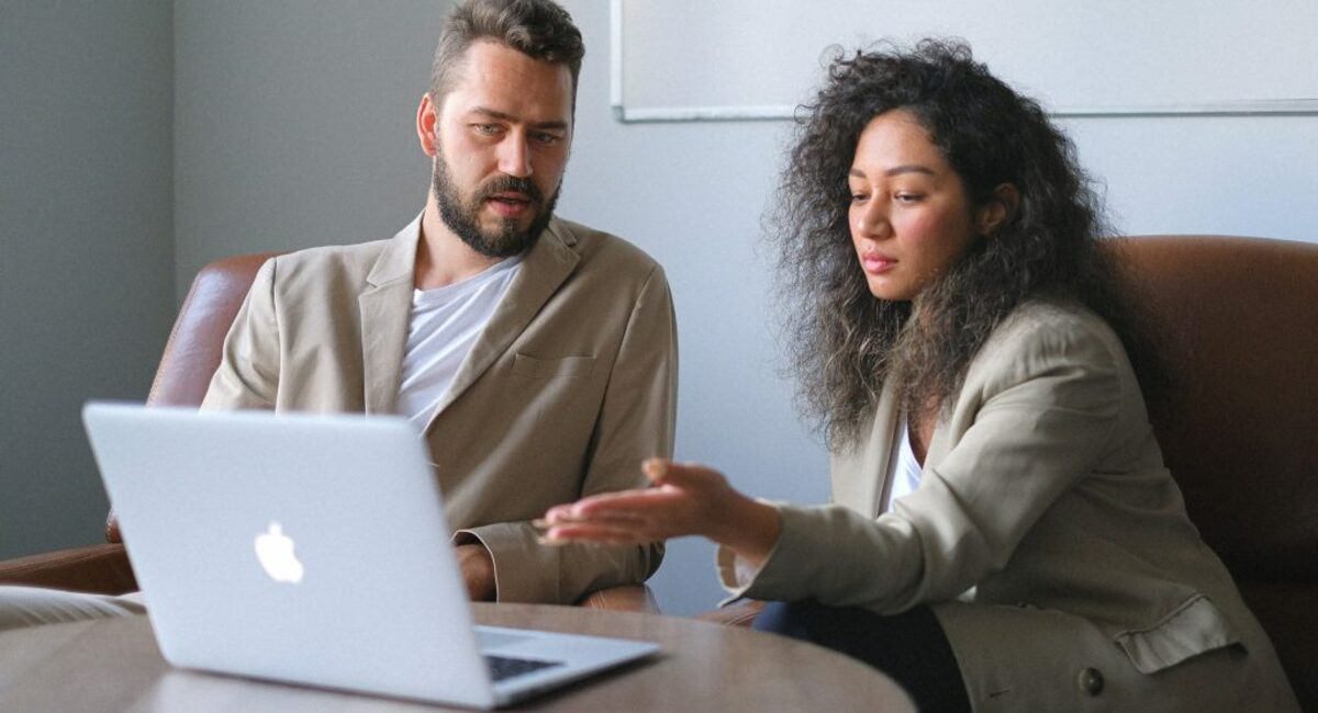 Focused man working with female colleague in office