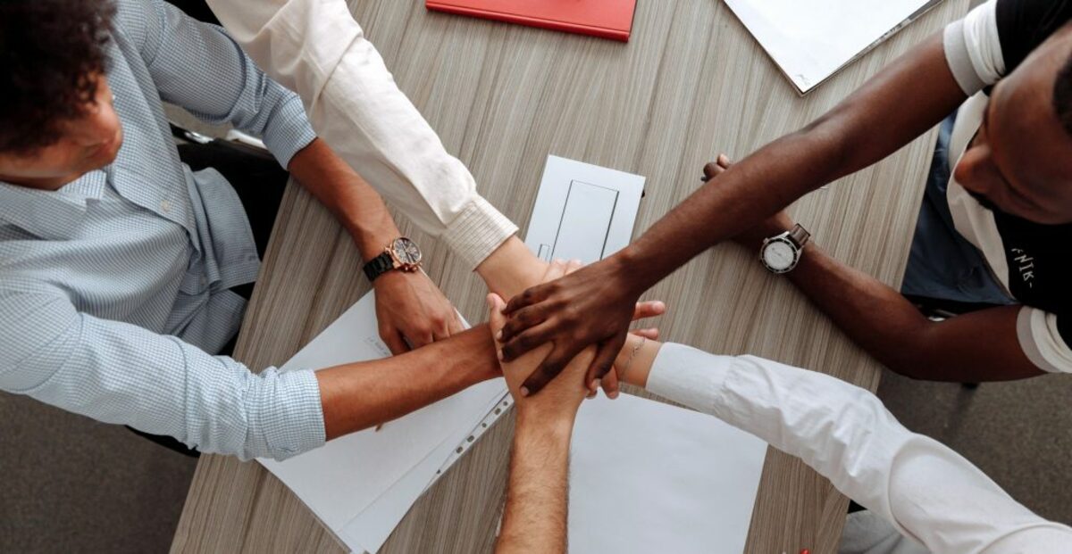 Man and woman holding each other s hands as a team