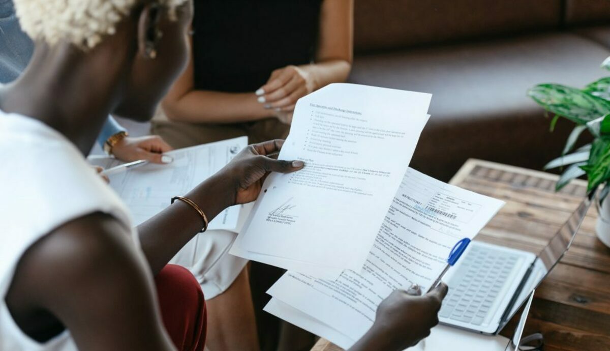 Black woman reading information of important document