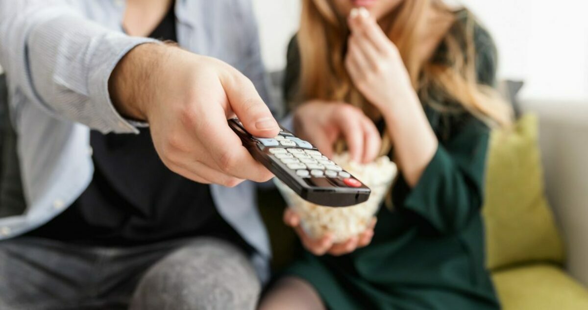 Man holding remote control