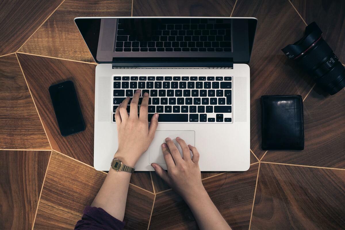 Person typing on keyboard