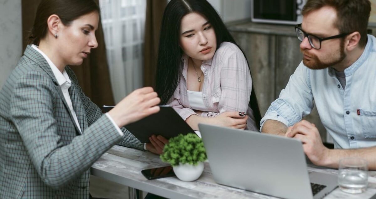 Group of people discussing notes together