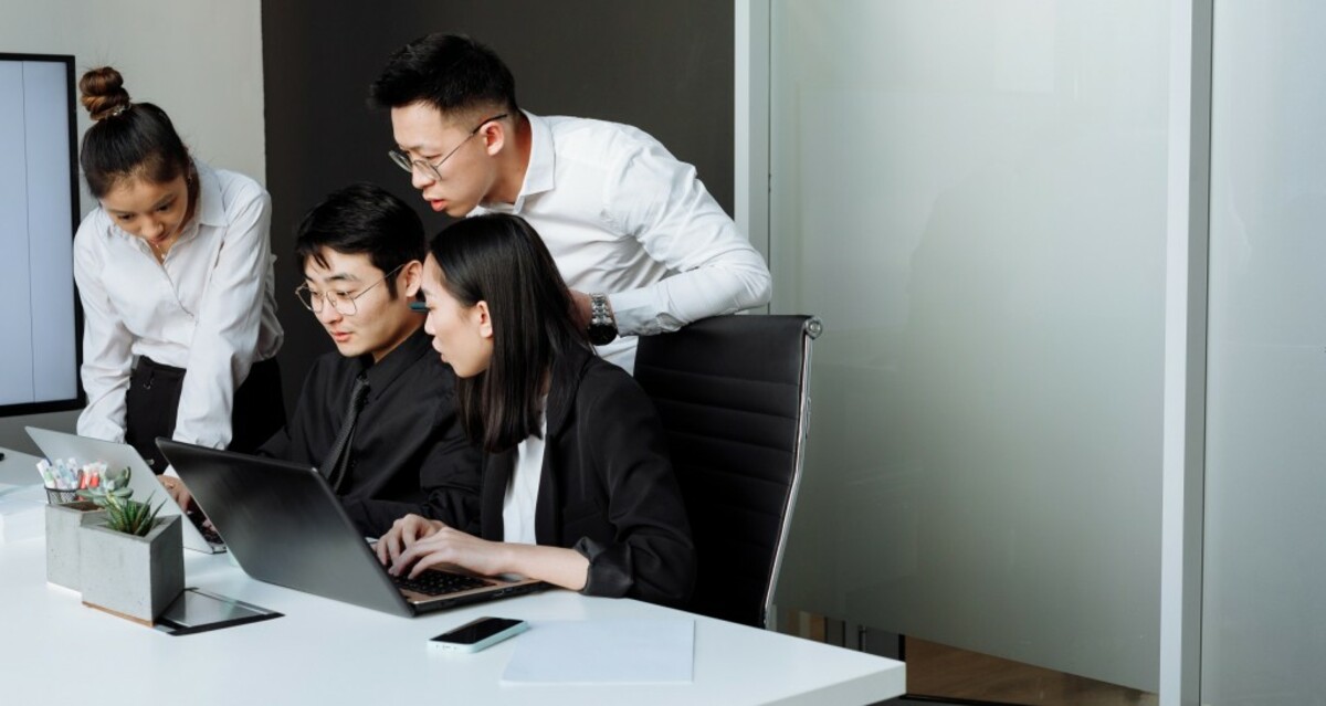 A group of people having a meeting in the office