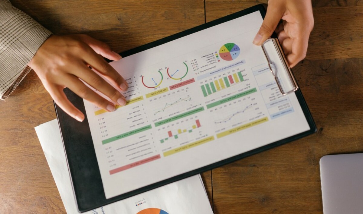 Charts and graphs on paper on a clipboard