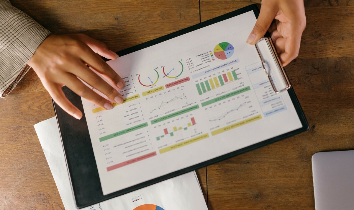 Charts and graphs on paper on a clipboard