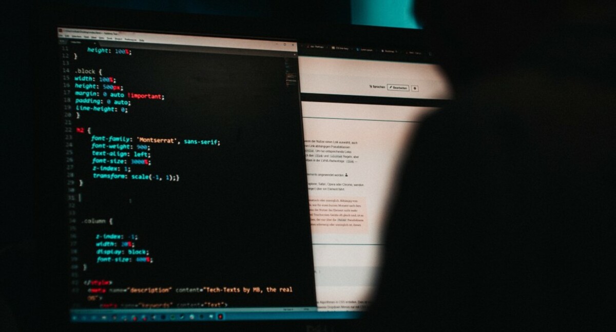 Someone programming a website in HTML. But also a photo suitable for hackers. ;)