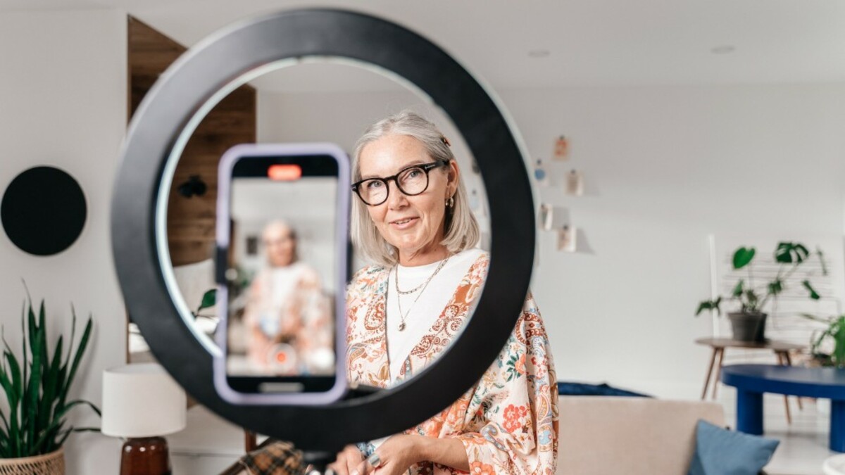 Woman recording herself with the phone